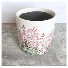 Load image into Gallery viewer, Lumelle Ceramic planter with floral design on a gray surface, featuring the brand 'LEAVERIE'.
