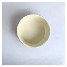 Load image into Gallery viewer, A single round ceramic bowl with a pale cream or off-white glaze, photographed from directly above on a plain light background.

