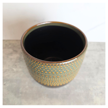 Load image into Gallery viewer, Lowell pot with gold and black design on a gray surface, featuring the Leaferie brand.
