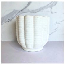 Load image into Gallery viewer, Ripple White ceramic planter with wavy texture on a marble background, featuring the Leaferie brand.
