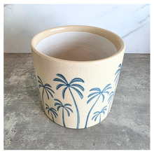 Load image into Gallery viewer, Arbor planters with palm tree design on a marble surface, featuring the Leaferie brand.
