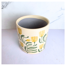 Load image into Gallery viewer, Tierra Decorative pot with floral design on a marble background, featuring the brand 'LEAFERIE'.
