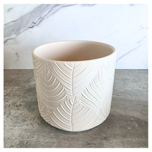 Load image into Gallery viewer, Ovelle Two white ceramic planters with leaf pattern on a marble surface, featuring the brand 'LEAFERIE'.
