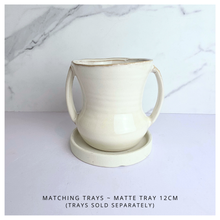 Load image into Gallery viewer, Ivora White ceramic mug with handles on a light gray background, featuring the LEAFERIE brand.
