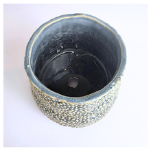Load image into Gallery viewer, Textured ceramic pot labeled &#39;Nubo&#39; with LEAFERIE branding on a light 
