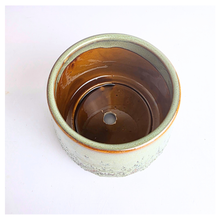 Load image into Gallery viewer, Tero Green ceramic cup with speckled texture on a white background, featuring the LEAFAERIE brand.
