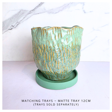 Load image into Gallery viewer, Lime Green ceramic vase with gold accents on a white background, featuring the Leaferie brand.
