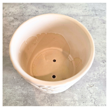 Load image into Gallery viewer, Silas White ceramic planter with leaf pattern on a gray surface, branded 'LEAFERIE'.
