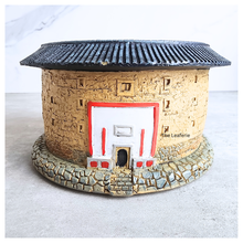 Load image into Gallery viewer, Decorative stone building with a red door on a white background
