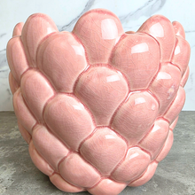 Load image into Gallery viewer, A pink ceramic planter with a textured, scaled leaf-like pattern, labeled 'Runa' by the brand LEAFERIE, set against a white marble background.
