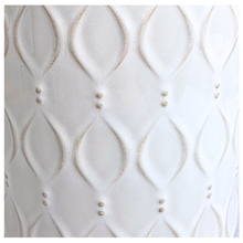 Load image into Gallery viewer, An off-white ceramic planter with a textured geometric leaf pattern, shown against a white marble background. The brand name 'LEAFERIE' is visible at the top, and the product name 'Oriva' is displayed at the bottom left.
