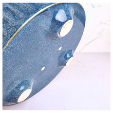 Load image into Gallery viewer, Bloom Blue ceramic bowl with textured surface on a white background, featuring the LEAFAERIE brand.
