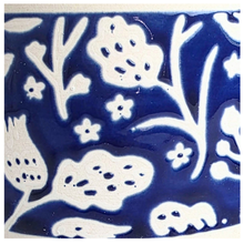 Load image into Gallery viewer, Close-up of a glossy cobalt blue and white floral patterned surface, likely ceramic or enamel.
