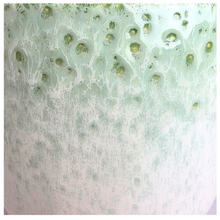 Load image into Gallery viewer, Calista Green textured vase on a marble background with 'LEAFERIE' branding.
