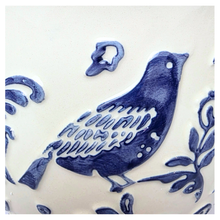 Load image into Gallery viewer, Camari Ceramic planter with blue bird and floral patterns on a white background, featuring the brand &#39;LEAFERIE&#39;.
