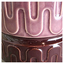 Load image into Gallery viewer, Zafira Brown ceramic planter with wavy pattern on a gray surface, branded 'LEAFERIE'.
