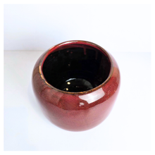 Load image into Gallery viewer, Soraya ceramic pots, one red and one green, with &#39;LEAFERIE&#39; branding on a white background.
