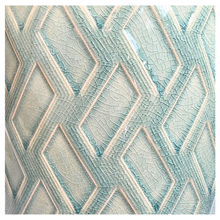 Load image into Gallery viewer, Rosso Green ceramic pot with geometric pattern on a light gray background, featuring the Leaferie brand.
