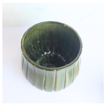 Load image into Gallery viewer, Zyra Green ceramic vase with striped pattern on a white background, featuring the brand &#39;LEAFERIE&#39;.

