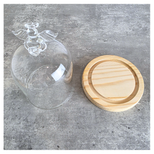 Load image into Gallery viewer, Angel Glass terrarium with a small plant on a wooden base, featuring the Leaferie brand.
