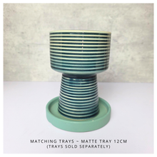 Load image into Gallery viewer, Marien Ceramic planter with striped design on a white surface, featuring the brand &#39;LEAFERIE&#39;.
