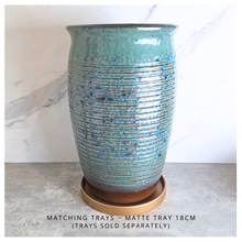 Load image into Gallery viewer, Aster Tall Decorative pot with speckled pattern on a marble surface, branded 'LEAFERIE'.
