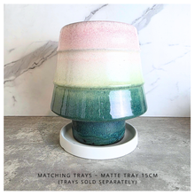 Load image into Gallery viewer, Pianta Multicolored ceramic pot with 'LEAFERIE' branding on a light background
