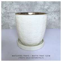 Load image into Gallery viewer, Yule snowflakes White textured planter with gold interior on a light gray background, featuring the Leaferie brand.
