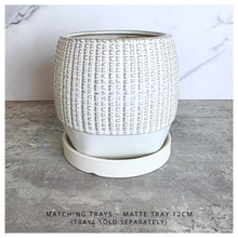 Load image into Gallery viewer, Emery ceramic planter on a gray surface with 'LEAFERIE' branding.
