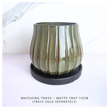 Load image into Gallery viewer, Zyra Green ceramic vase with striped pattern on a white background, featuring the brand &#39;LEAFERIE&#39;.
