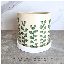 Load image into Gallery viewer, Marvelle Ceramic planter with green leaf pattern on a gray surface, branded 'LEAFAERIE'.
