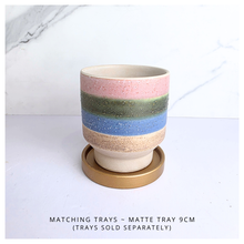 Load image into Gallery viewer, Tetra Ceramic cup with multicolored stripes on a light background, featuring the brand &#39;LEAFAERIE&#39;.
