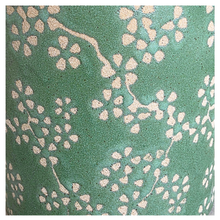 Load image into Gallery viewer, Alina pot Green plant pot with floral pattern on a wooden surface, branded 'LEAFAERIE'.
