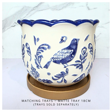 Load image into Gallery viewer, Camari Ceramic planter with blue bird and floral patterns on a white background, featuring the brand &#39;LEAFERIE&#39;.
