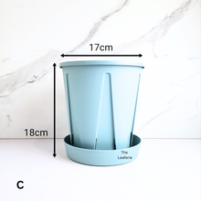 Load image into Gallery viewer, Blue planter with dimensions labeled on a white marble background
