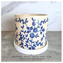 Load image into Gallery viewer, Caelis Ceramic planter with blue floral pattern on a marble surface, featuring the brand 'LEAFAERIE'.
