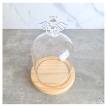 Load image into Gallery viewer, Angel Glass terrarium with a small plant on a wooden base, featuring the Leaferie brand.
