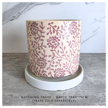 Load image into Gallery viewer, Iris planter with floral pattern on a marble surface, featuring the brand 'LEAFERIE'.
