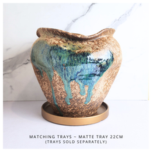 Load image into Gallery viewer, Raku ceramic vase with gold and blue glaze on a white background, featuring the Leaferie brand.
