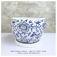 Load image into Gallery viewer, Aveline Ceramic planter with blue floral pattern on a gray background, featuring the Leaferie brand.
