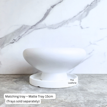 Load image into Gallery viewer, Xara ceramic flowerpot in white, black, and green with Leaferie branding.
