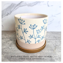Load image into Gallery viewer, Evie floralCylindrical fabric basket with blue floral patterns on a light background, featuring the brand 'LEAFERIE'.
