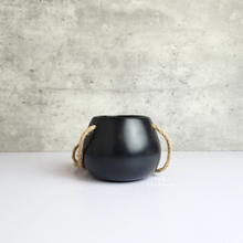 Load image into Gallery viewer, The Leaferie Lyon hanging pot (Series 13). 3 colours pink, white and black. ceramic material. photo shows black mini
