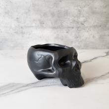 Load image into Gallery viewer, The Leaferie Comee skull plant pot. side view . black colour

