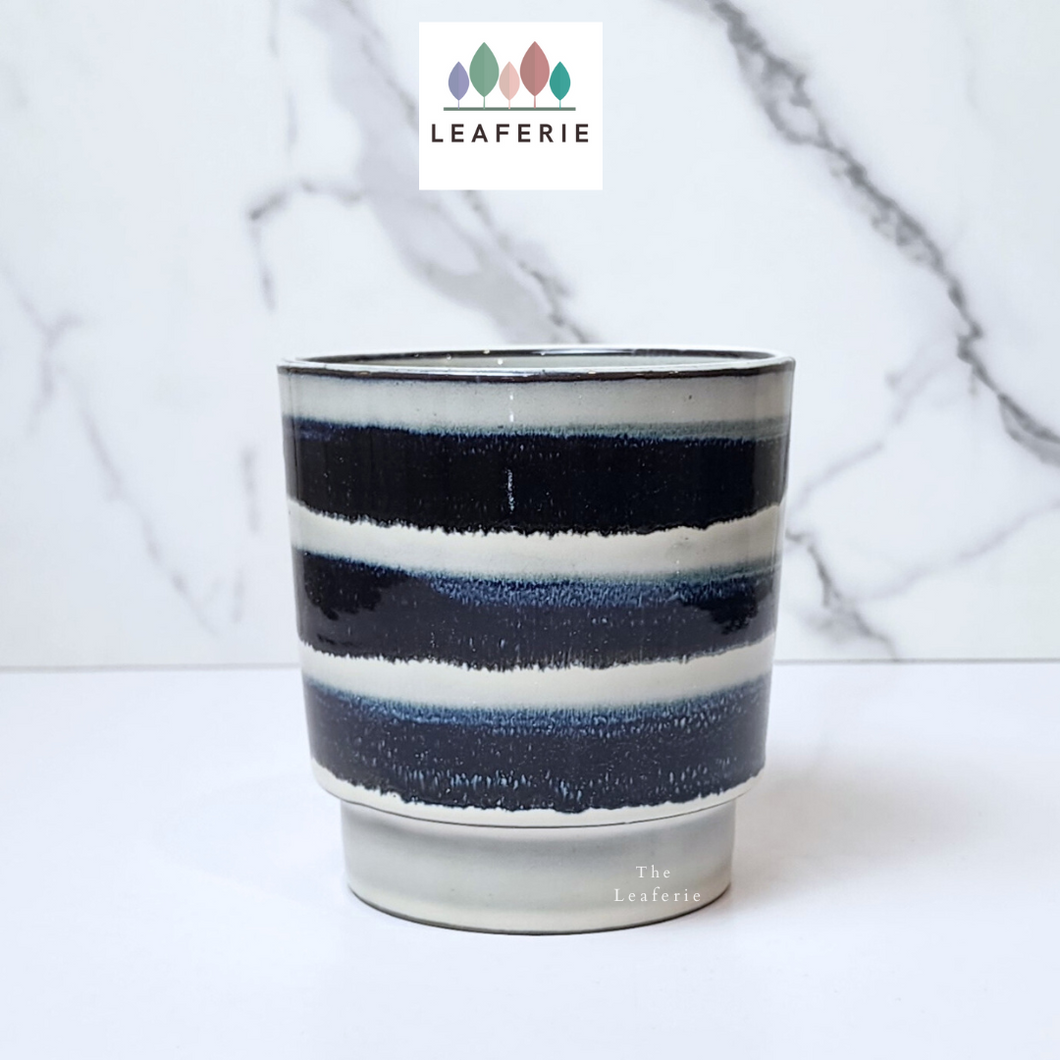 The Leaferie Makoto plant pot. blue stripes ceramic planter . Front view