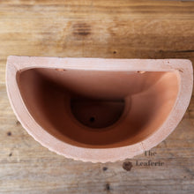 Load image into Gallery viewer, The Leaferie croia terracotta wall hanging planter. top view
