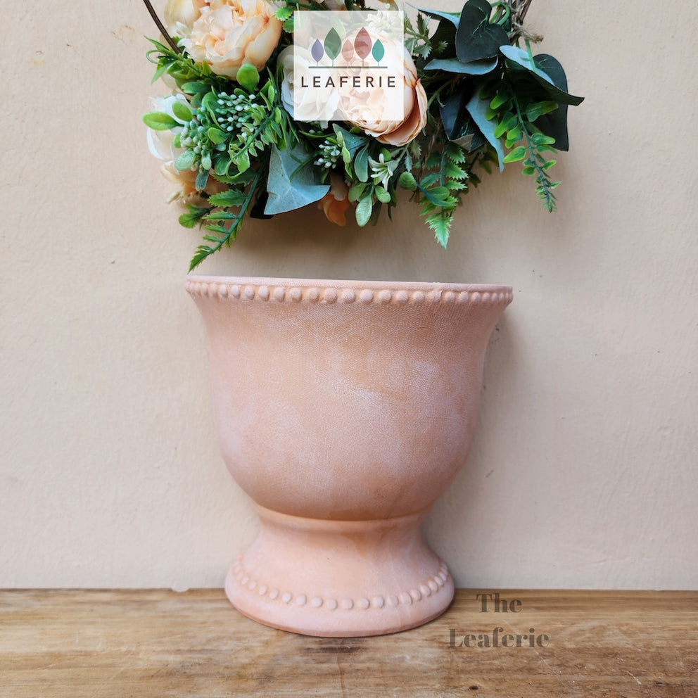 The Leaferie croia terracotta wall hanging planter. front view