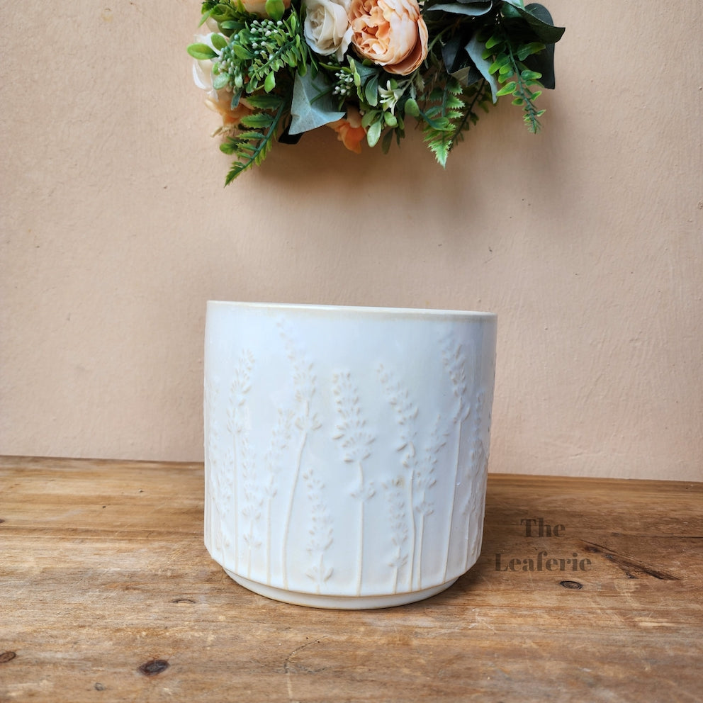The Leaferie Saone plant pot . 2 colours and sizes. ceramic material. front view of white mini