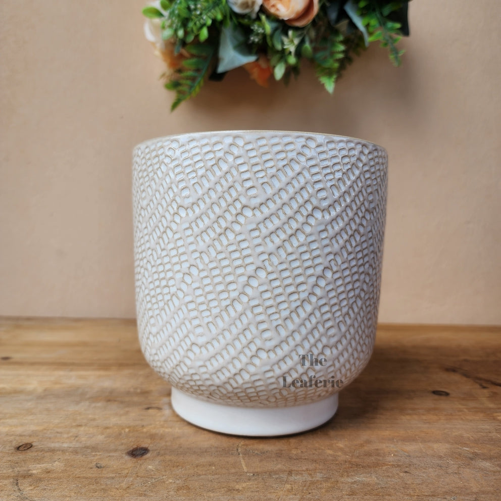 The Leaferie Bronagh Plant pot. ceramic white and orange pot . front view of design A