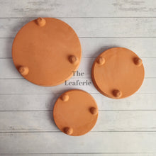 Load image into Gallery viewer, The Leaferie Terracotta round trays with stand . 3 sizes.  bottom view
